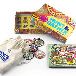 Board game set with colorful packaging, cards, and a drawstring bag on a white background