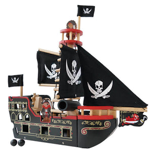 Wooden toy pirate ship with black sails and skull and crossbones flags on a white background