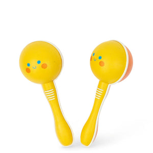 A pair of bright yellow and orange maracas music toys with smiling face details on a white background.