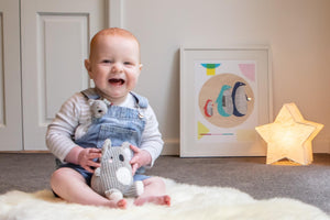 baby holding tiger tribe sensory set koala buddies
