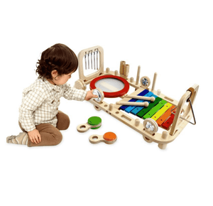 child playing with wooden i'm toy melody bench musical instrument set
